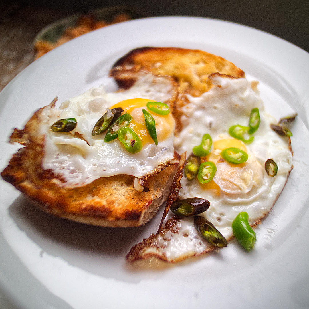 World of Chillies fried eggs on toast topped with sliced green chillies