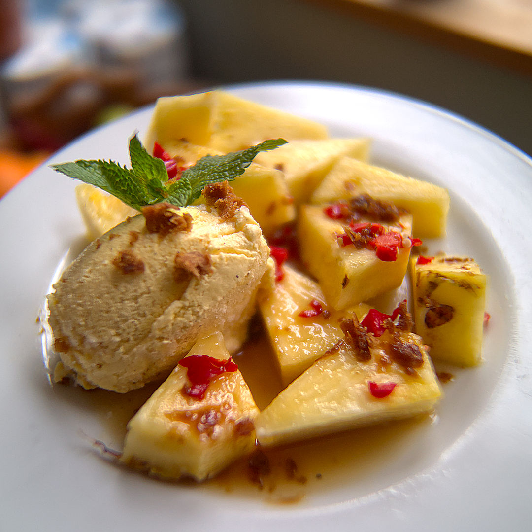 World of Chillies pineapple and vanilla ice cream dessert with fresh red chilli
