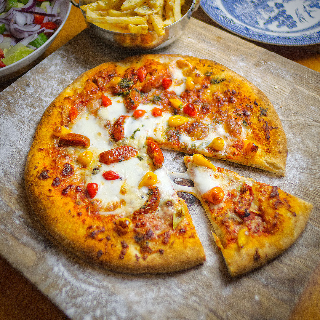 World of Chillies pizza topped with Yellow and Red Biquinho chillies